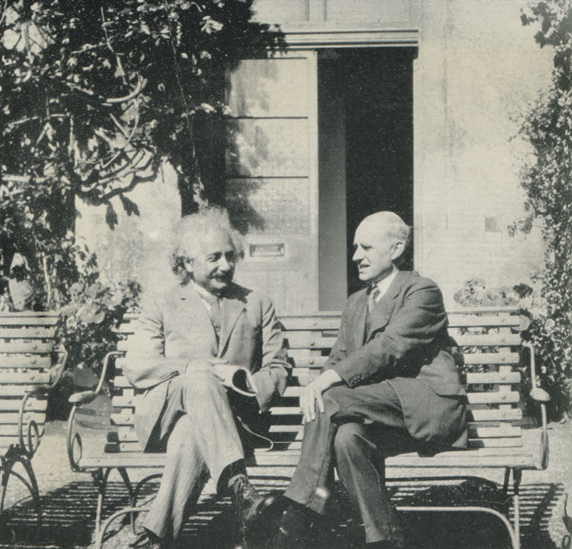 Einstein came back to England several times in the early 1930s. In this shot, taken in June 1930, he is in conversation with Eddington in the garden of the Observatory at Cambridge. From a photo attributed to Winifred Eddington